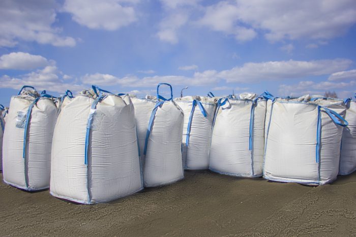 A large number of tonne bags in a field